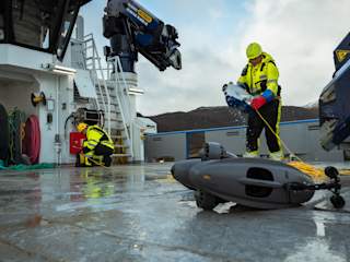 Operators aquaculture with two ROVs