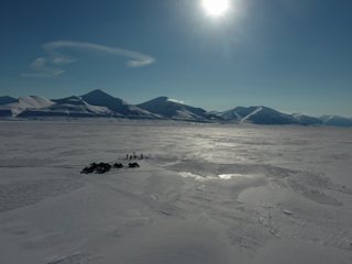 Team preparing hole in the ice