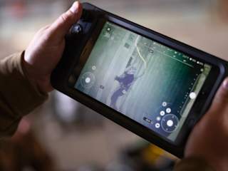 Rugged Controller - Navy diver assessing damage to a bulkhead