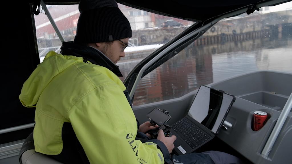 Alex testing Blueye ROV in a boat