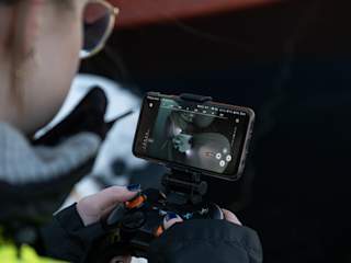 Person diving with X3 ROV using a controller