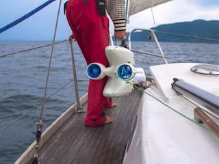 Co-Founder & VP Marketing Christine getting ready to launch the drone from her sailboat