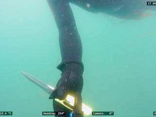 Blueye X1 with Newton gripper handing knife back to diver