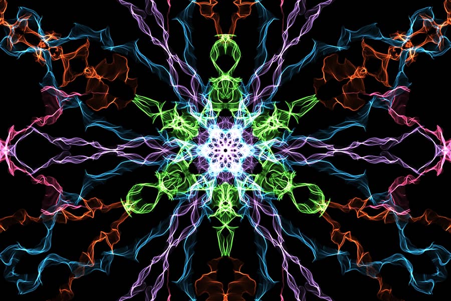 Image of artwork created on weavesilk.com. The artwork features colourful wiggly lines crossing over each other to create a hypnotic pattern. 