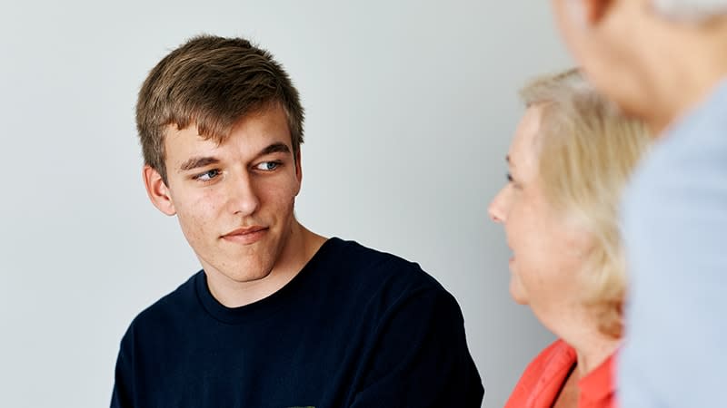 teenage guy talking to parents