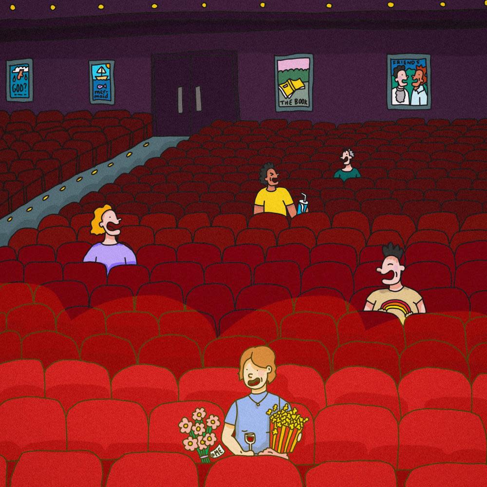 Person sitting alone in movie theatre