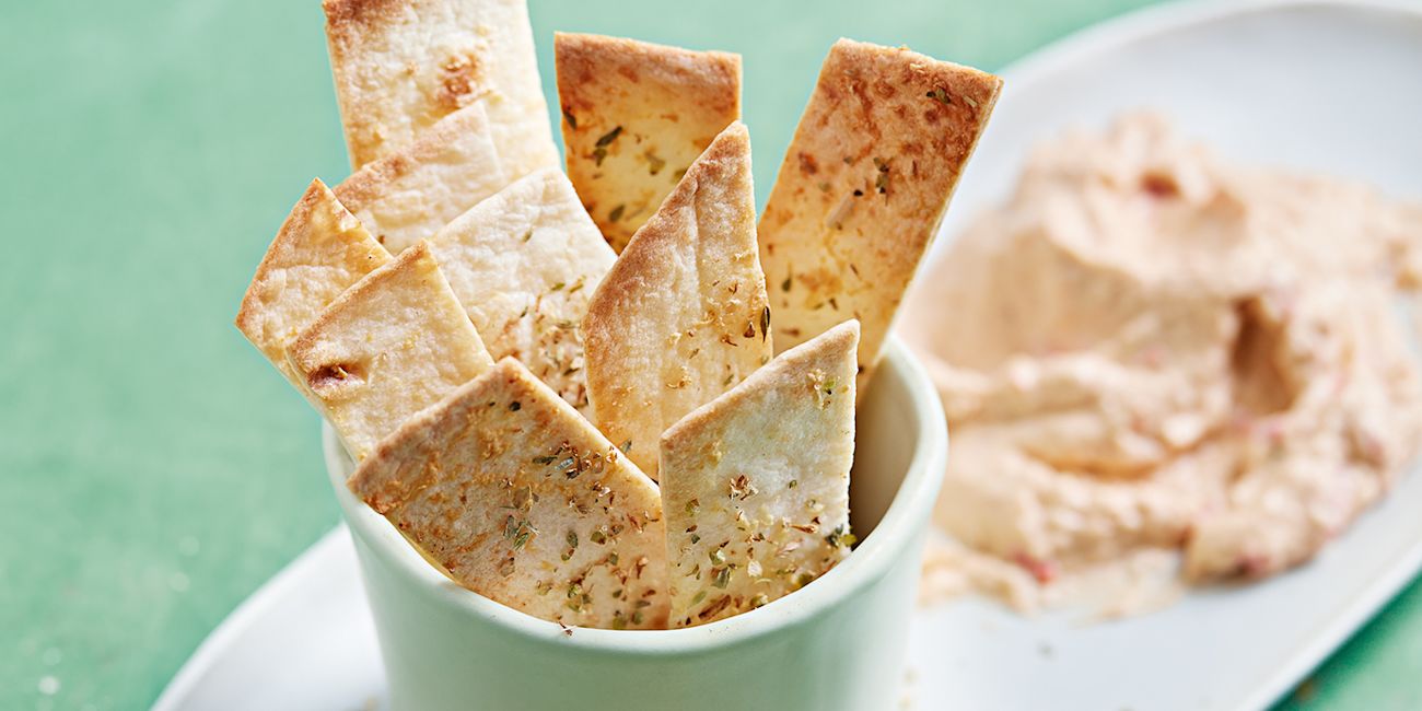 Tortilla chips with red pepper houmous Tortilla chips with red pepper houmous