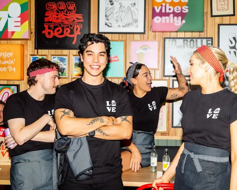 Grill'd staff members in uniform smiling