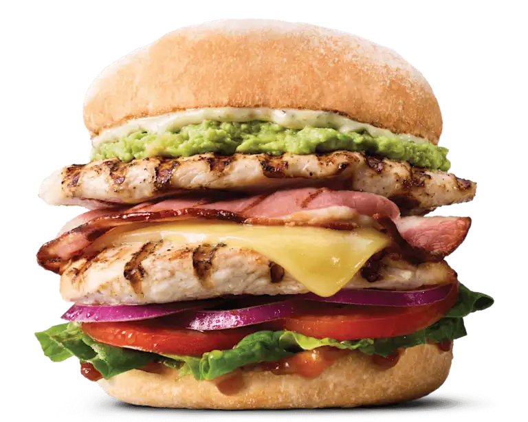 Protein Pro burger with 2 grilled chicken breast patties, cheese, bacon, avocado, lettuce, tomato onion, relish and herbed mayo.