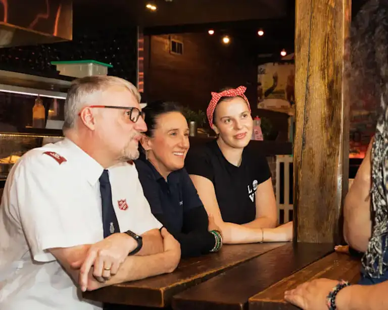 Grill'd staff member with Salvation Army and Vinnies volunteers