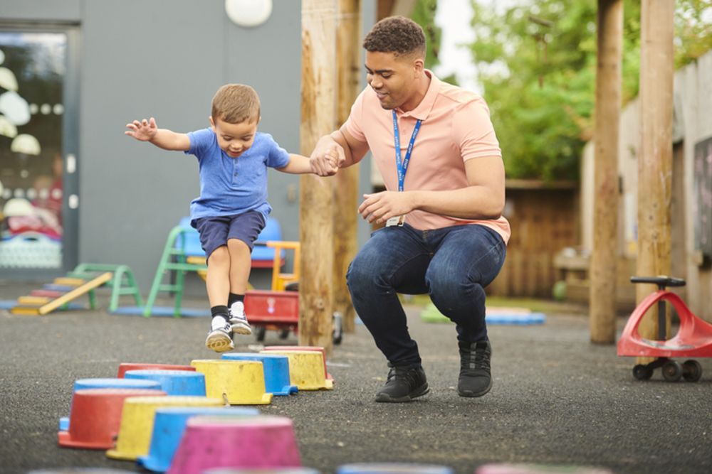 Man with child at nursery