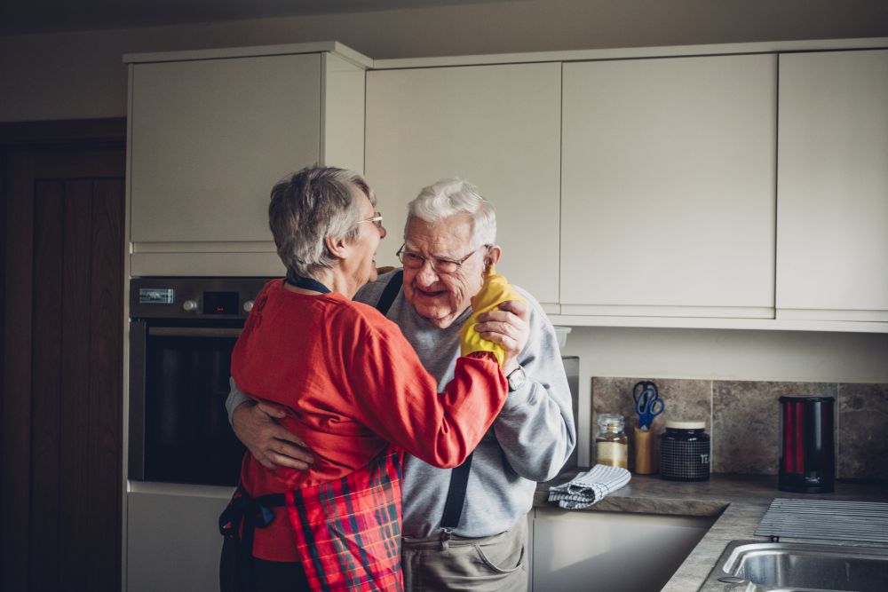 old couple dancing in their kitchen