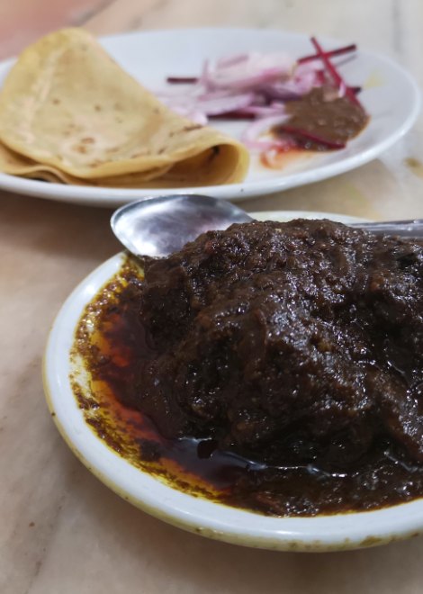 Mouth-watering mutton curry with freshly made chapattis