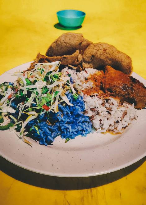 Nasi kerabu - rice cooked with blue pea shoots