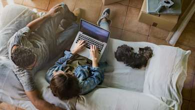 Man and woman sat on sofa