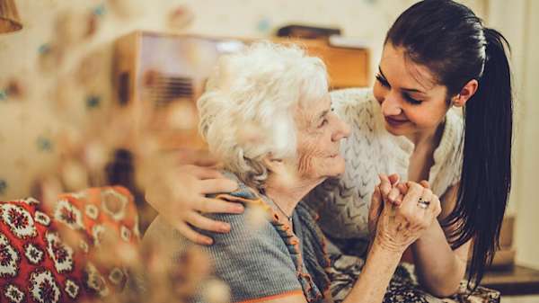 Grandmother and granddaughter holding hands