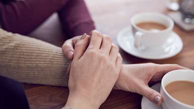 Hand on arm to comfort