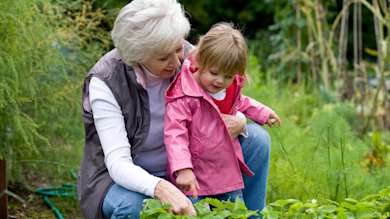 Grandmother holding granddaughter