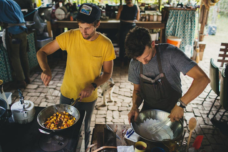 Geoffrey Holstad assisting Chef Nick Stockton in the Old Way open-air kitchen, Cabin-Time: Pokey Creek