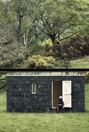 An Austere Off-Grid Cabin in Wales Relies on Reclaimed Slate