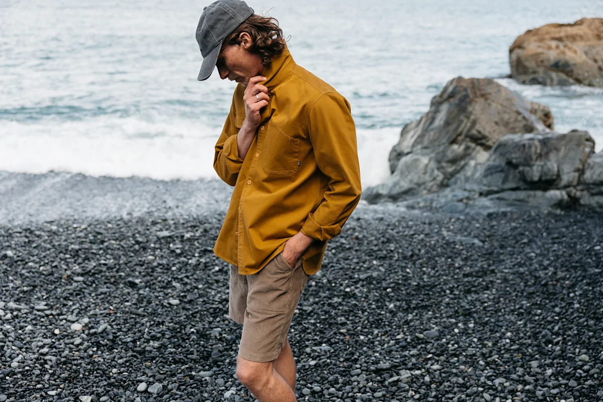 textile-dyes-feature-finisterre-yellow-shirt-beach-lifestyle