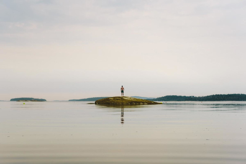 Geoffrey Holstad exploring low tide, Cabin-Time: Archipelago, Photo: Carson Davis Brown