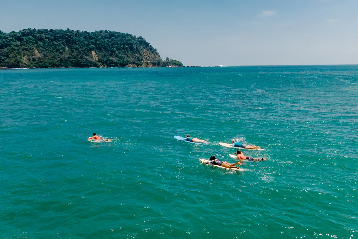 surf-synergy-surfing-group-paddling-daytime