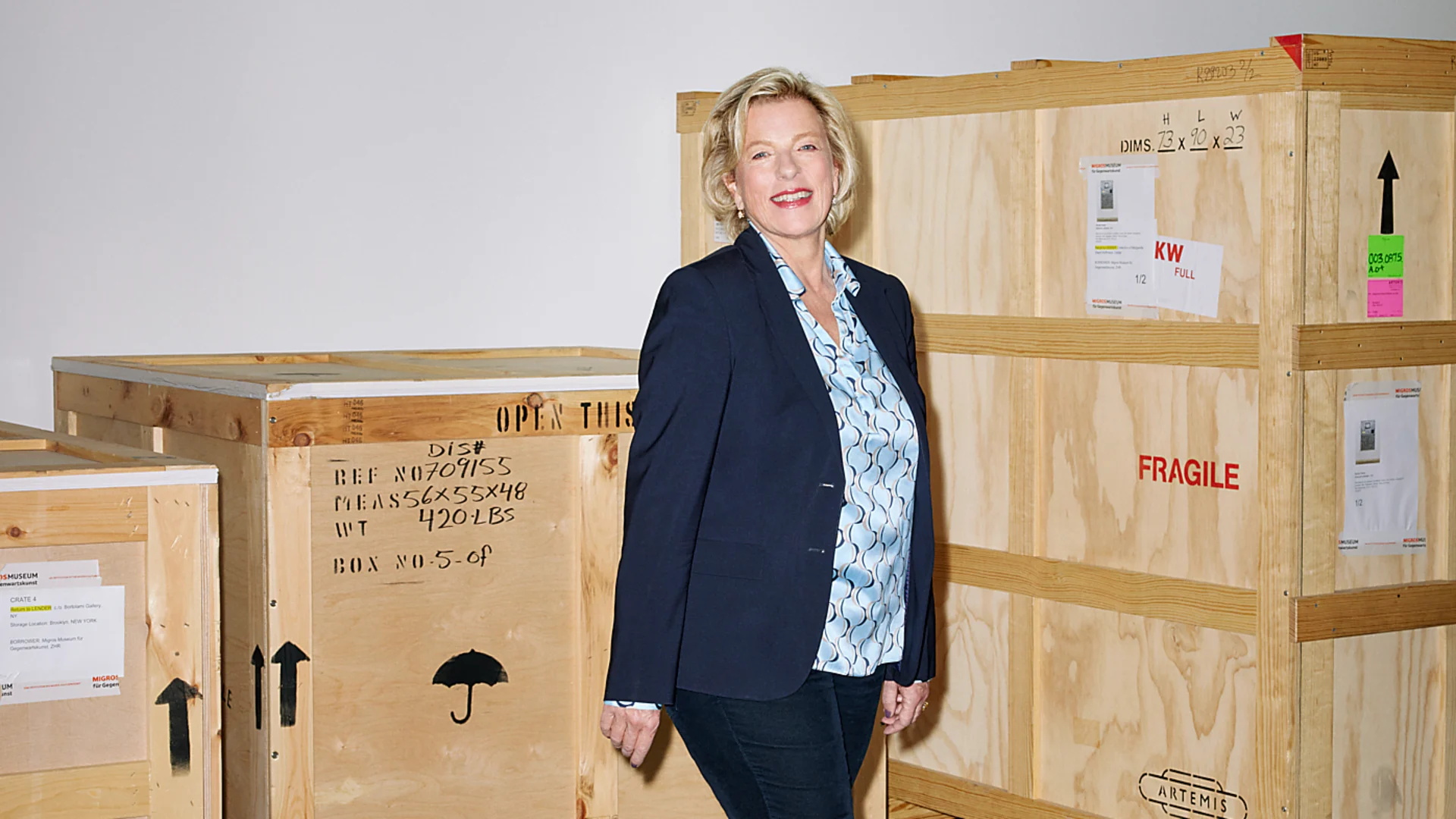 Be like Hedy Graber Hedy Graber stands in front of wooden crates ready for dispatch.