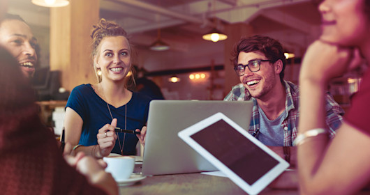 Shot of students studying in a coffee shop