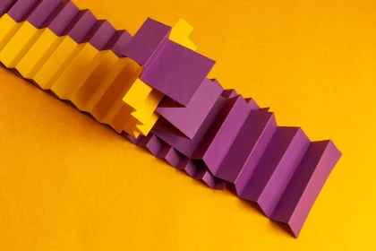 Two strips of paper folded into an accordion shape and intertwined