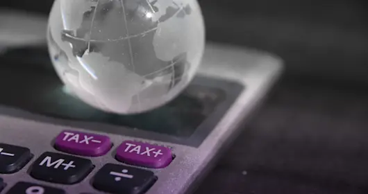 virtual image of a globe resting on a calculator