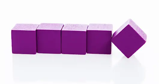 Wooden blocks in a row on white background