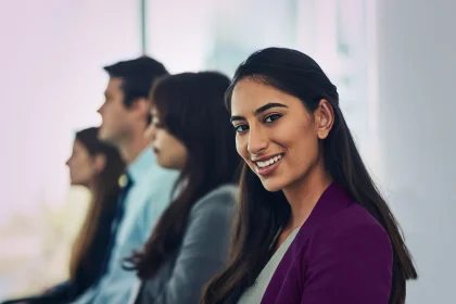 Portrait of a confident young businesswoman attending a conference in a modern office