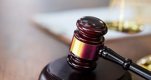 Justice Scales and books and wooden gavel