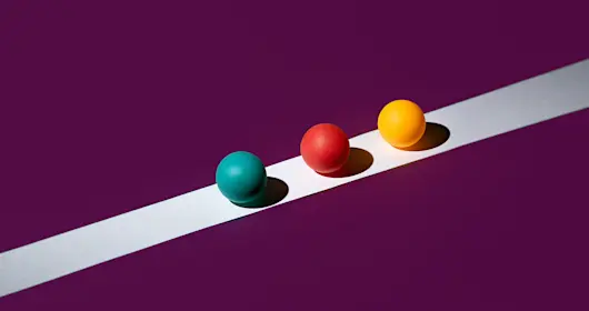Multicolored balls on a white line