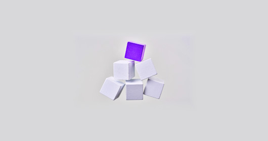 Abstract floating wooden pyramid on white background