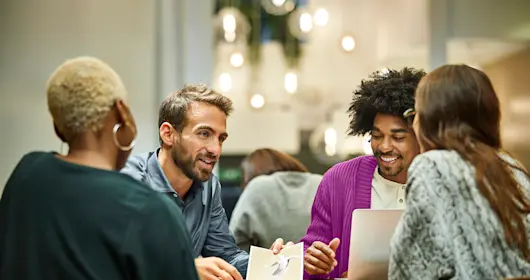 Coworkers discussing a project in the office