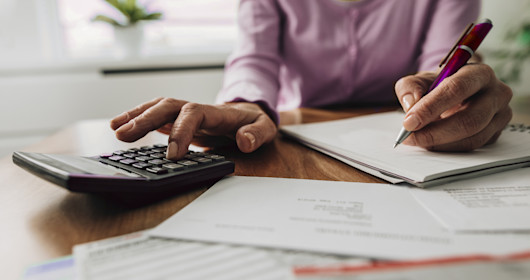 woman using calculator