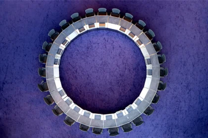 Circular boardroom table with chairs - overhead view