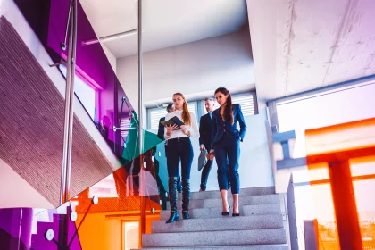 business people walking down the stairs