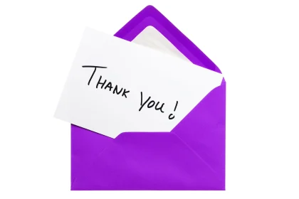 Purple envelope with thank-you card sticking out