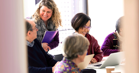 Smiling business people in conference room meeting