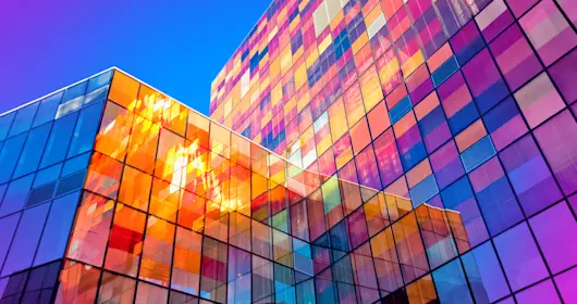 External view of office building with windows reflecting light