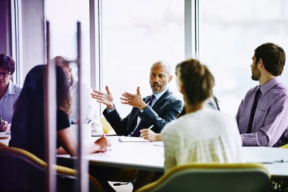 businessman leading meeting in office