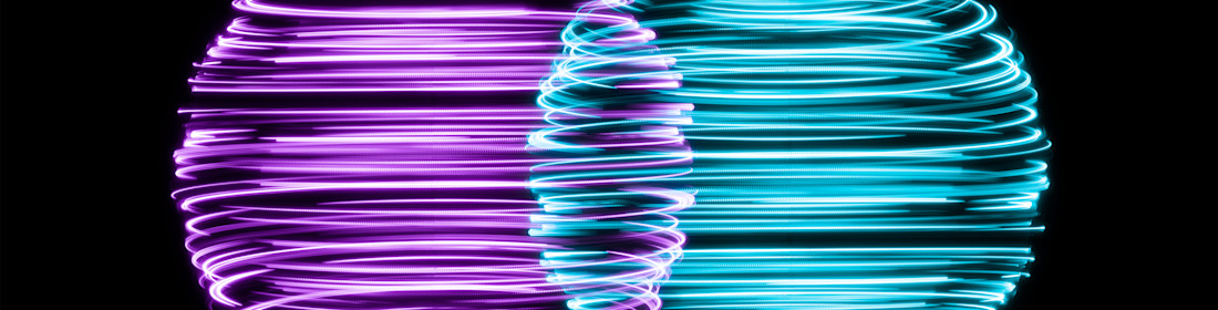 Spinning Light Trails Spheres Intersection on Black Background