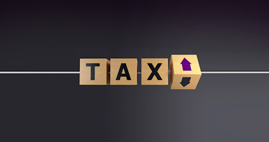 Wooden blocks spelling tax