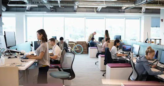 Creative business people working at computers