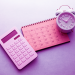 calculator, clock and calendar on desk