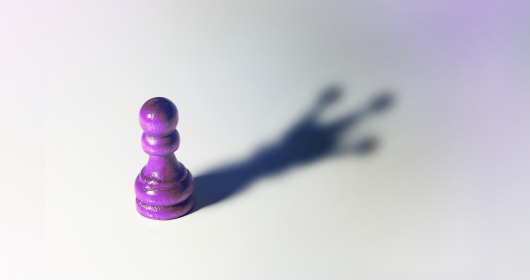  chess pawn with king shadow