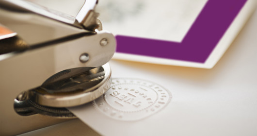 stamper making seal on paper